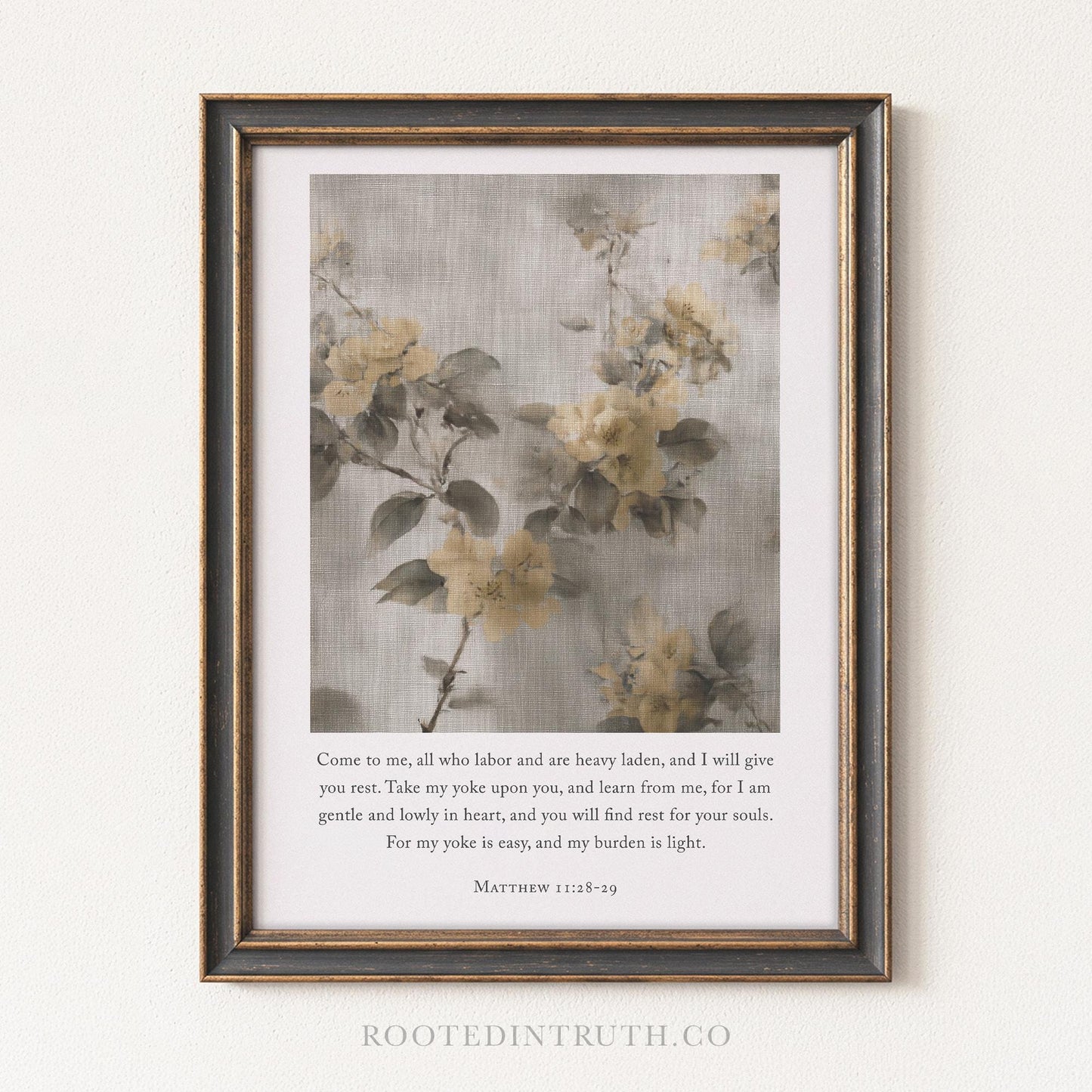 The image is a framed print featuring a floral design with yellow flowers against a light gray background. The text below the image provides a biblical verse from the book of Matthew, referencing the importance of labor and the value of one's heart.
