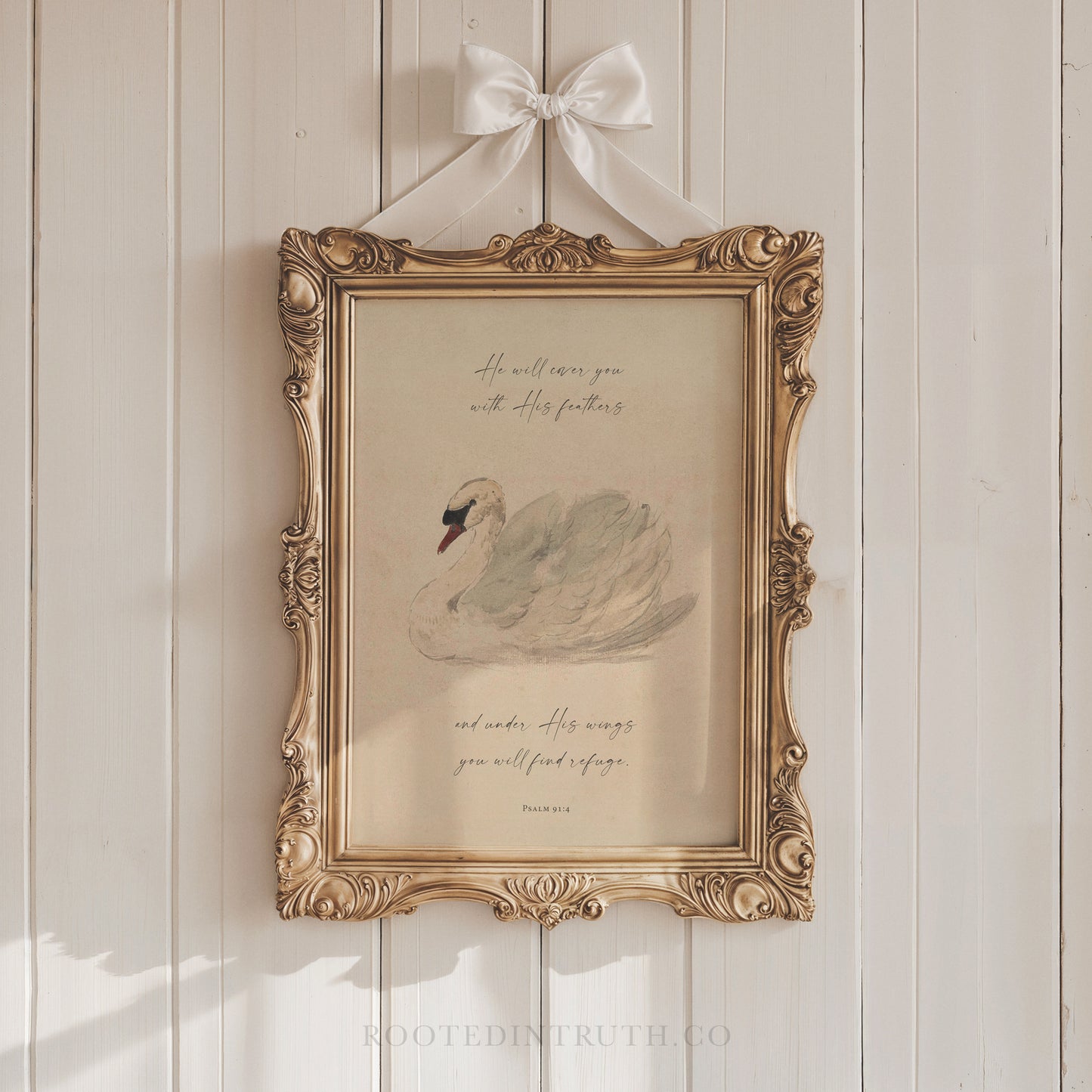 a picture of a swan hanging on a wall