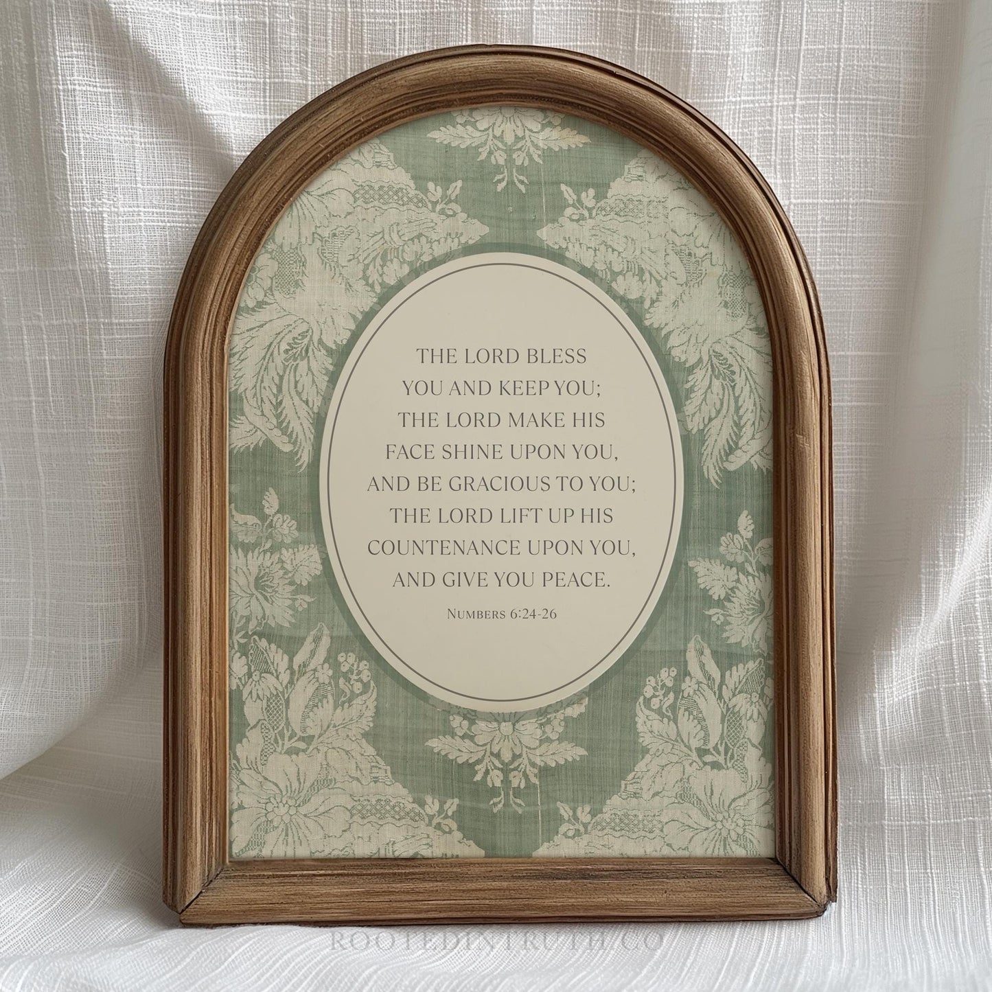 Numbers 24 bible verse in a brown vintage style frame. Has floral textile print behind it in soft green.