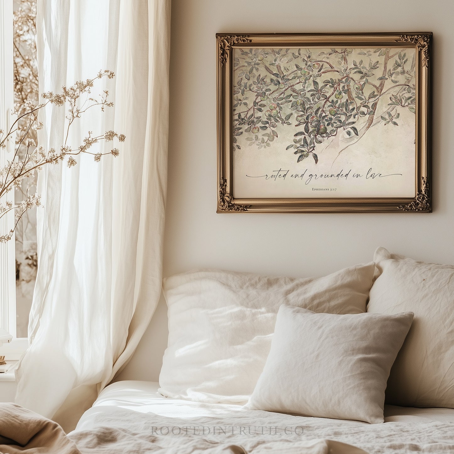 a picture of a tree hanging above a bed