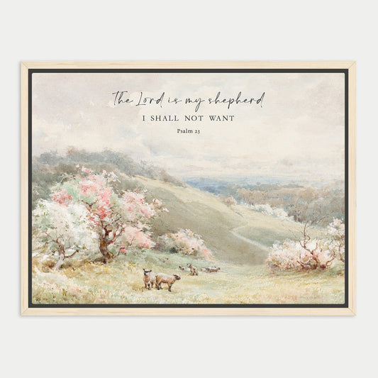 The image is a framed painting depicting a pastoral scene with a flock of sheep grazing in a grassy field, surrounded by trees and hills. The text overlay reads "The Lord is my shepherd I shall not want" and is located at the top of the image.