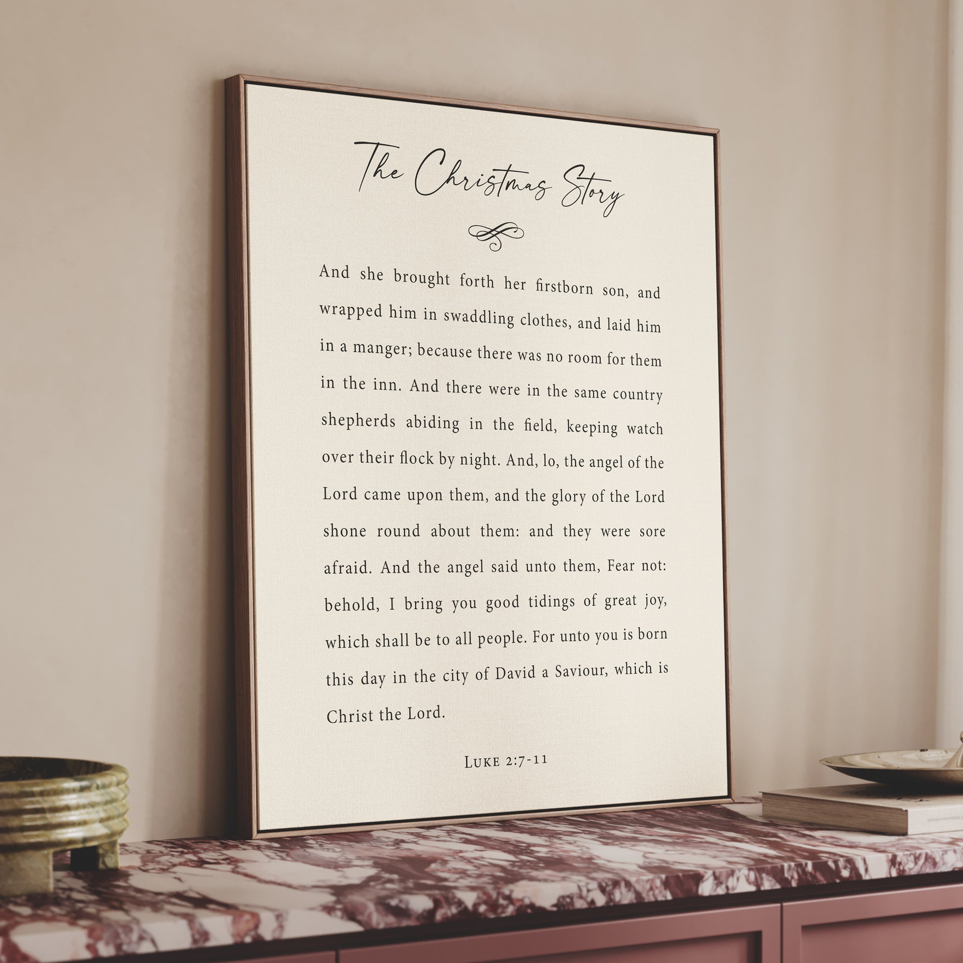 a framed text titled "The Christmas Story" on a shelf, with a white background and black text.