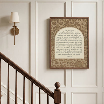 a framed religious text, specifically a passage from the Bible, hanging on a wall next to a wooden staircase.