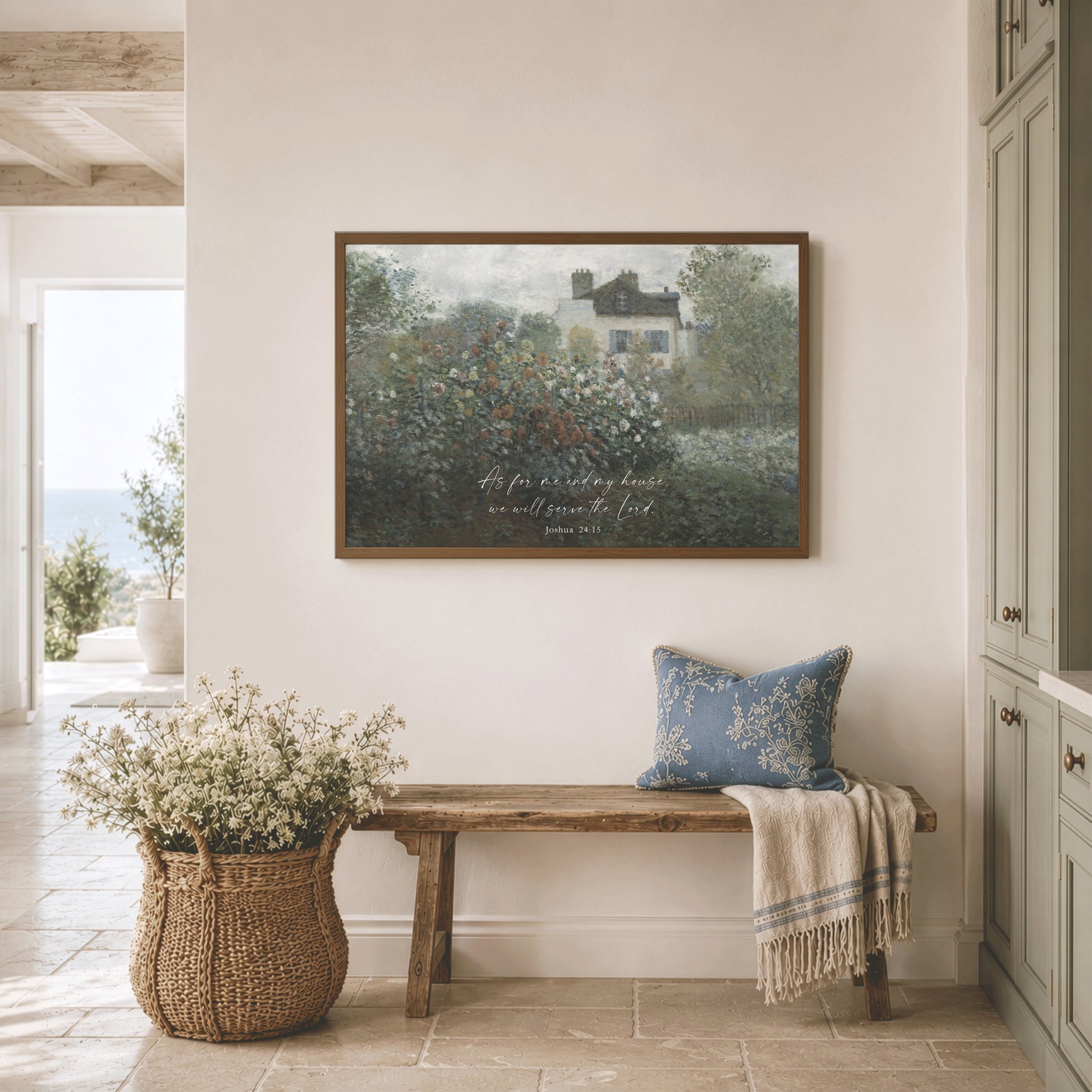 a serene and cozy interior with a wooden bench, a woven basket filled with white flowers, and a framed painting of a house with a garden hanging on the wall.