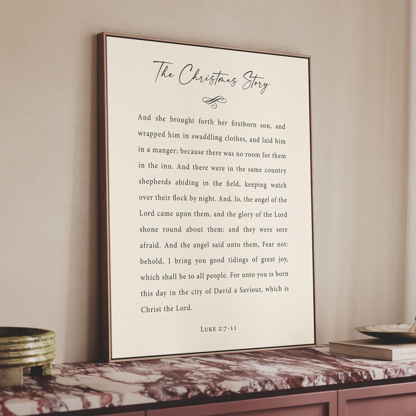 a framed text titled "The Christmas Story" on a shelf, with a white background and black text.
