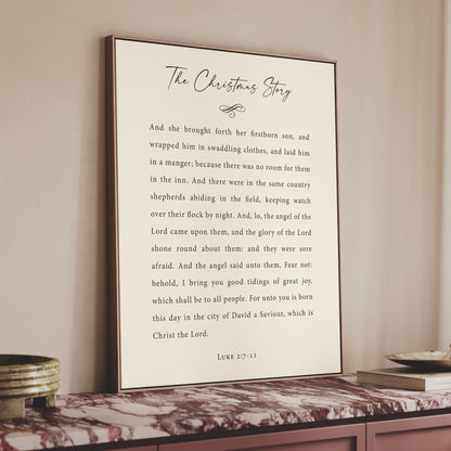a framed text titled "The Christmas Story" on a shelf, with a white background and black text.