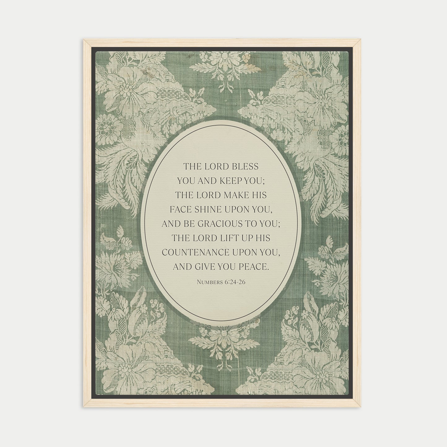 The image is a framed print featuring a floral pattern and a central text quote from the Bible, specifically the Book of Common Prayer.