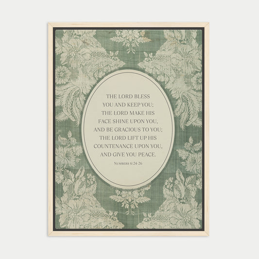 The image is a framed print featuring a floral pattern and a central text quote from the Bible, specifically the Book of Common Prayer.