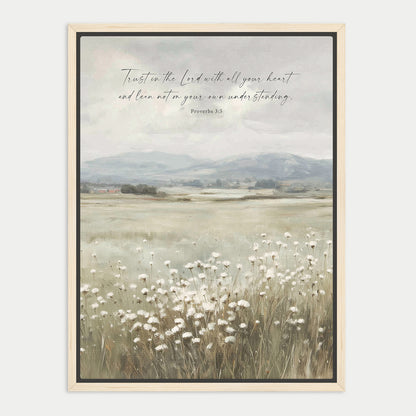 The image is a framed print depicting a serene landscape with a field of white flowers in the foreground and a mountainous background. The text overlay reads "Trust in the Lord with all your heart and lean not on your own understanding. Proverbs 3:5".