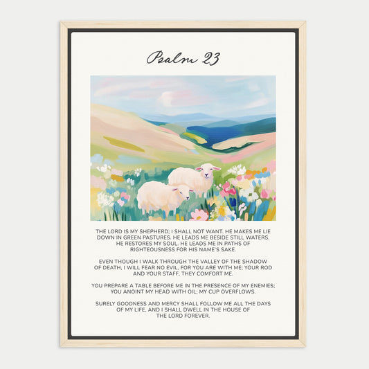 The image is a framed print of a Bible verse from the book of Psalms, specifically Psalm 23. The verse is written in a serif font and is framed in a wooden frame. The text is in black ink and is centered within the frame. The background of the image features a pastoral scene with a field of flowers and a flock of sheep.