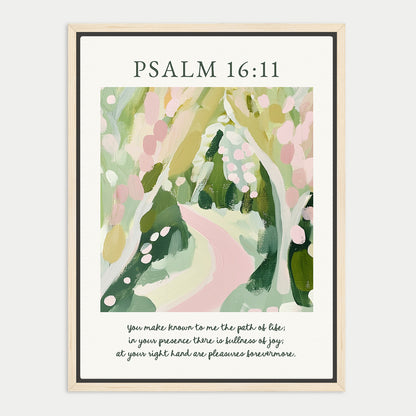 The image is a framed print featuring an abstract painting of a winding path through a lush, green landscape. The text above the painting reads "PSALM 16:11", and below the painting, there is a Bible verse from the book of Psalms that reads "You make known to me the path of life; in your presence there is but joy; at your right hand are pleasing ways tomorrow."
