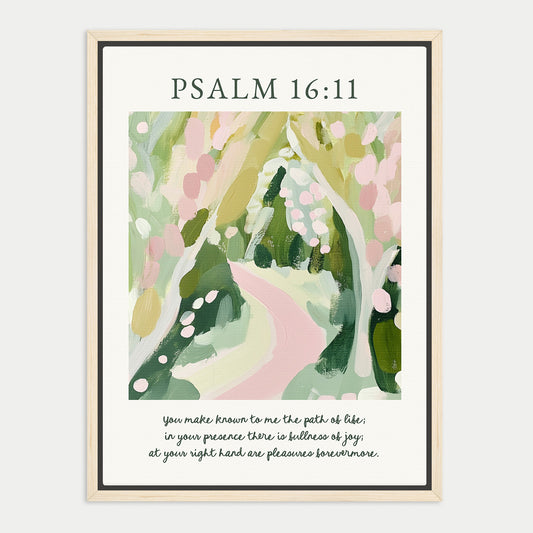 The image is a framed print featuring an abstract painting of a winding path through a lush, green landscape. The text above the painting reads "PSALM 16:11", and below the painting, there is a Bible verse from the book of Psalms that reads "You make known to me the path of life; in your presence there is but joy; at your right hand are pleasing ways tomorrow."