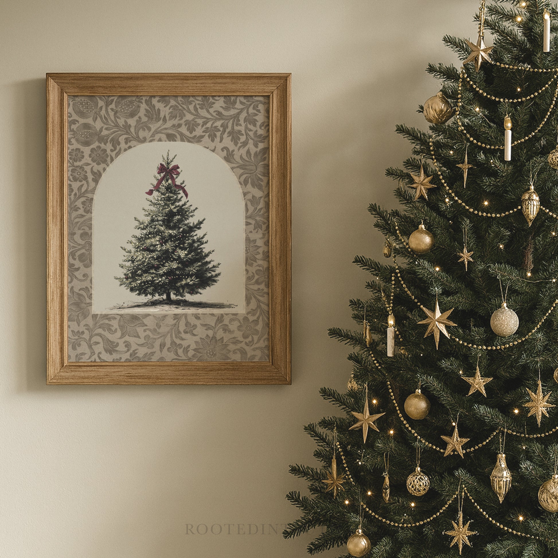 a beautifully decorated Christmas tree adorned with gold ornaments and lights, and a framed picture of a Christmas tree hanging on the wall next to it.