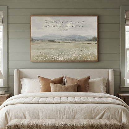 a bedroom with a large bed, a framed landscape painting hanging above it, and a window on the right side.