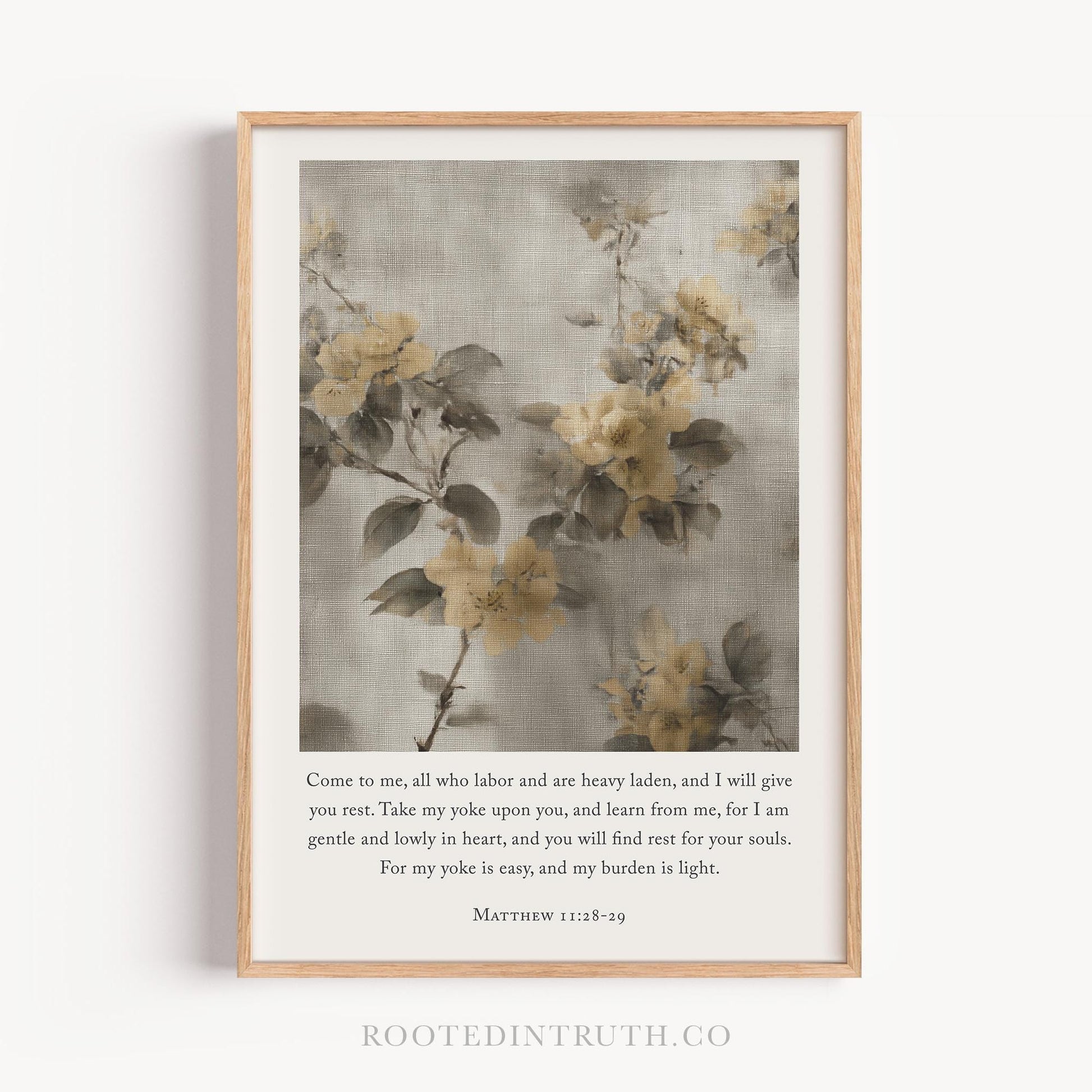 The image is a framed print featuring a floral design with yellow flowers against a gray background. The text below the image provides a biblical verse from Matthew 22:8-29.