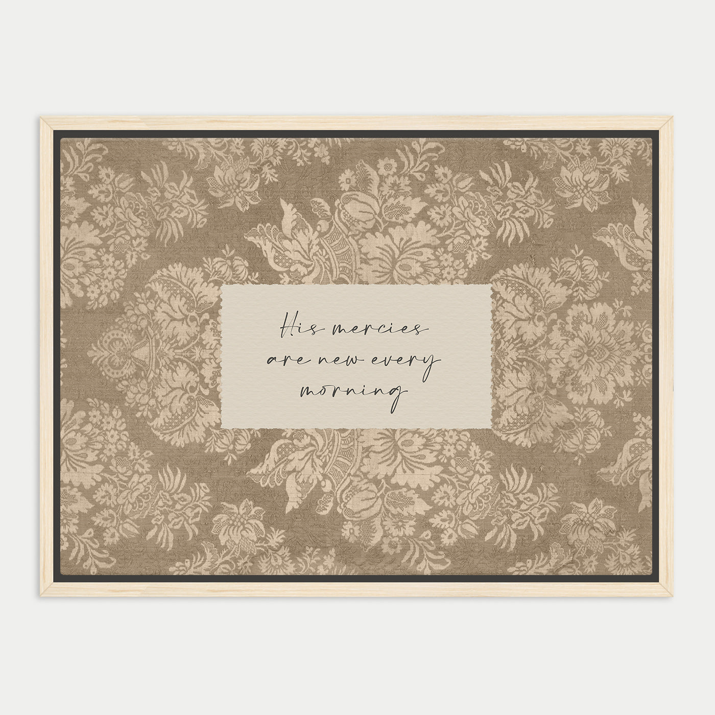 a framed print with a floral pattern and a handwritten message in the center.