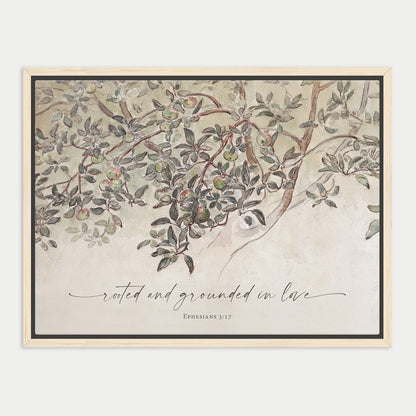 The image is a framed print featuring a detailed illustration of a tree with lush foliage and branches. The text "rooted and grounded in love" is written in cursive below the image, and the Bible verse "Ephesians 3:17" is also present.