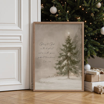 A framed print of a snowy landscape with a Christmas tree in the background, accompanied by a Bible verse from the book of Luke.