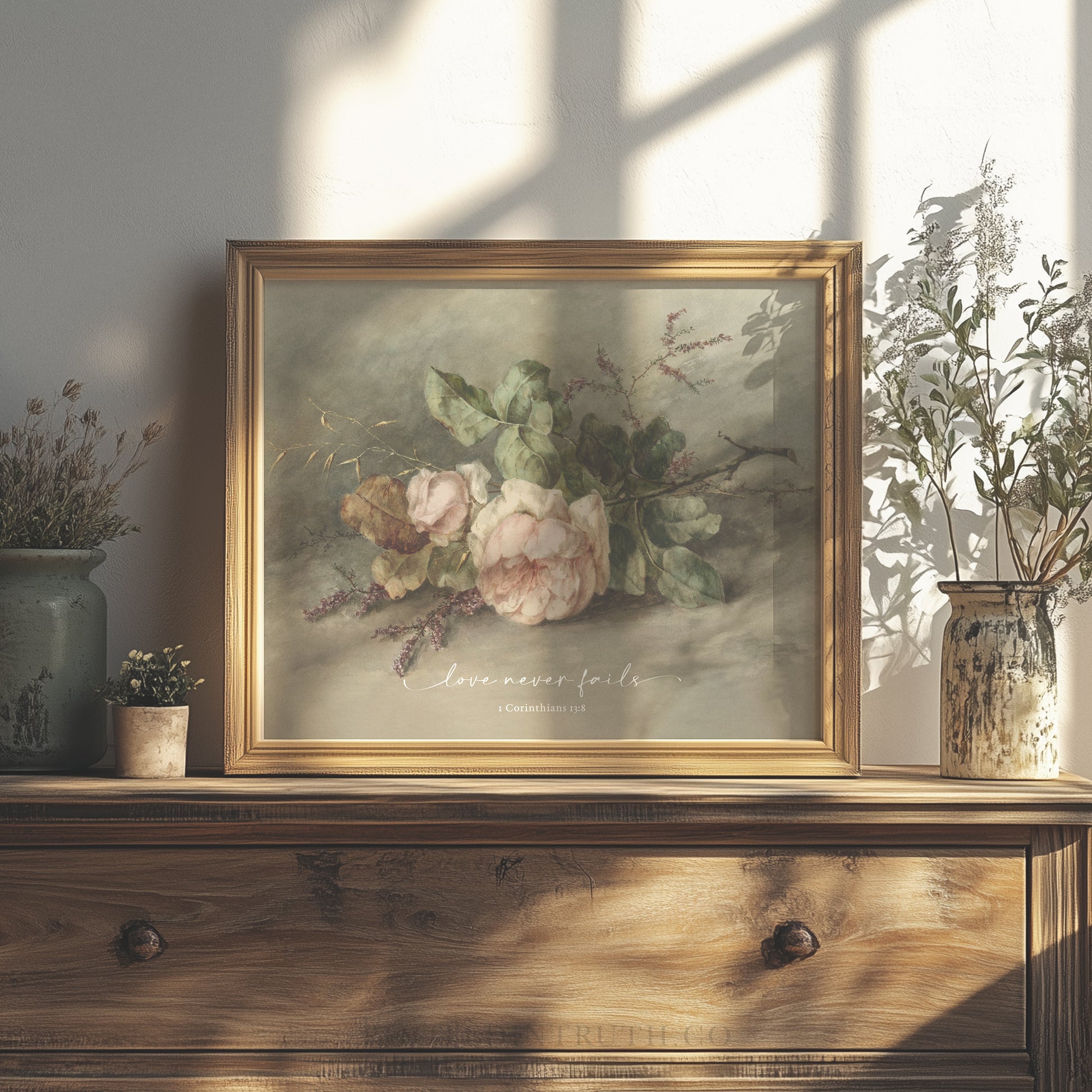 a painting of flowers on a shelf next to a potted plant