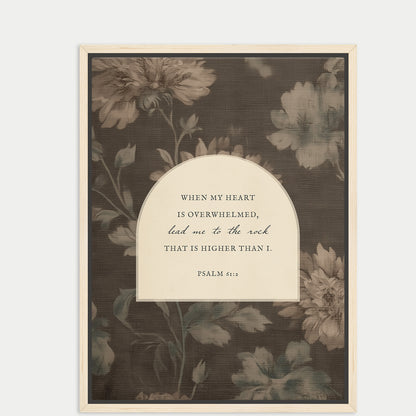The image is a framed print featuring a floral pattern and a Bible verse from Psalm 46:11.