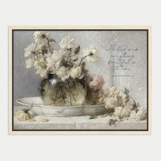 A framed painting depicting a vase filled with white roses, accompanied by a Bible verse from Ecclesiastes 9:11.