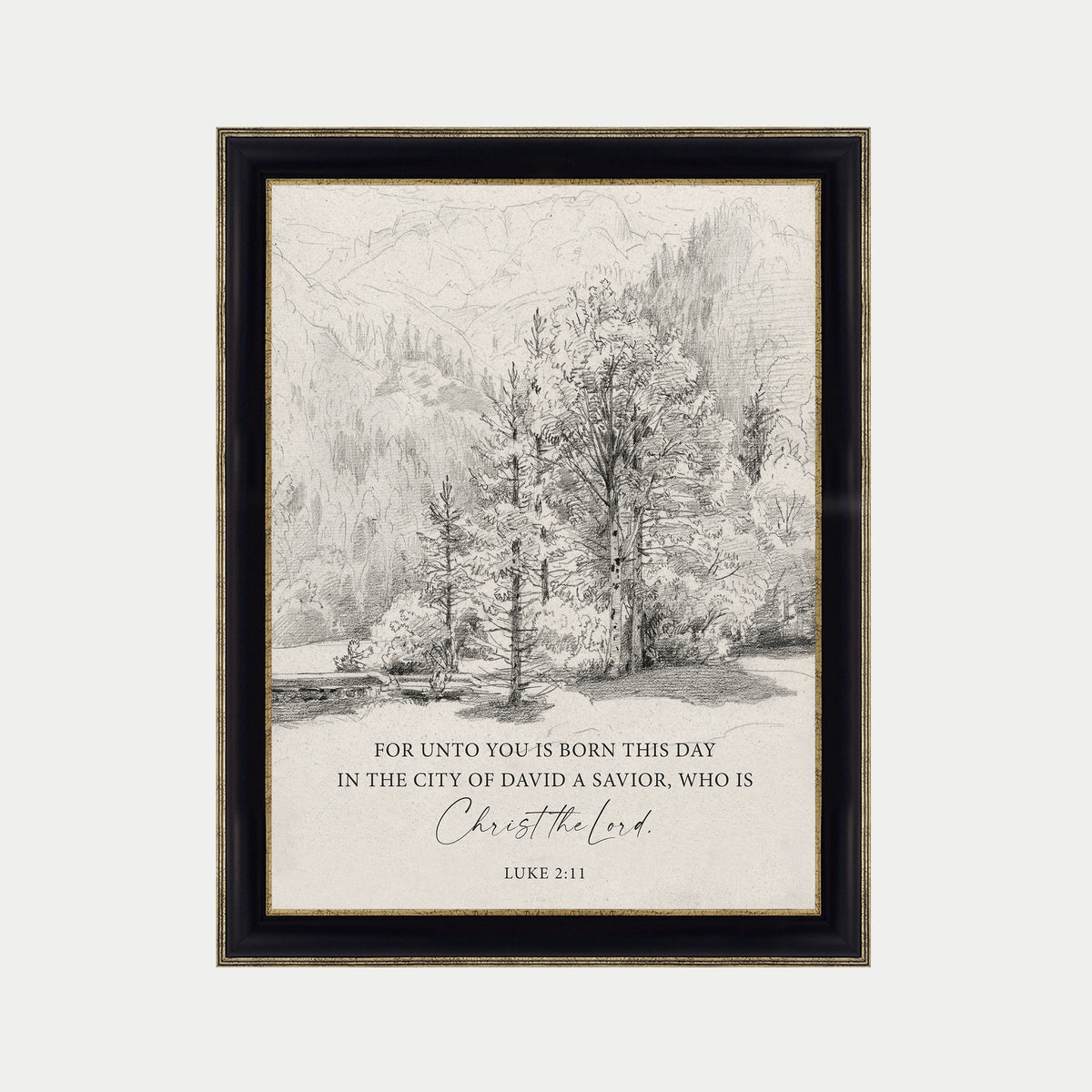 The image is a framed print featuring a black and white illustration of a forest landscape with trees and mountains in the background. The text below the image reads "FOR UNTO YOU IS BORN THIS DAY IN THE CITY OF DAVID A SAVIOR, WHO IS CHRIST THE LORD. LUCY 3:11".