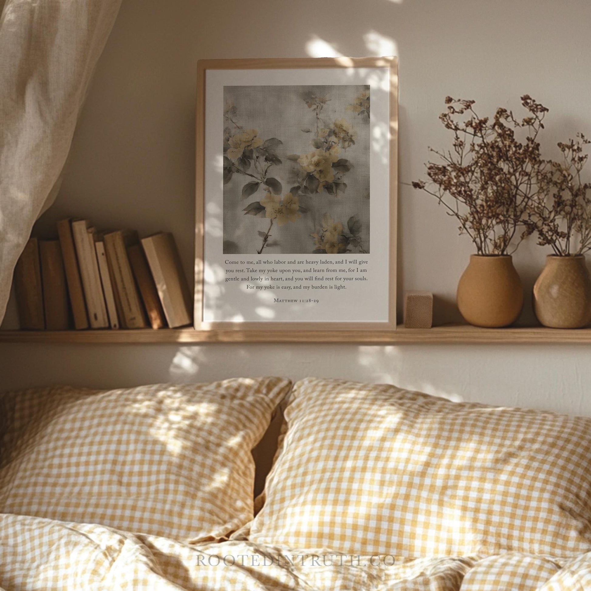 a cozy bedroom scene with a bed, a shelf with books, a framed picture of flowers, and two vases with dried flowers.