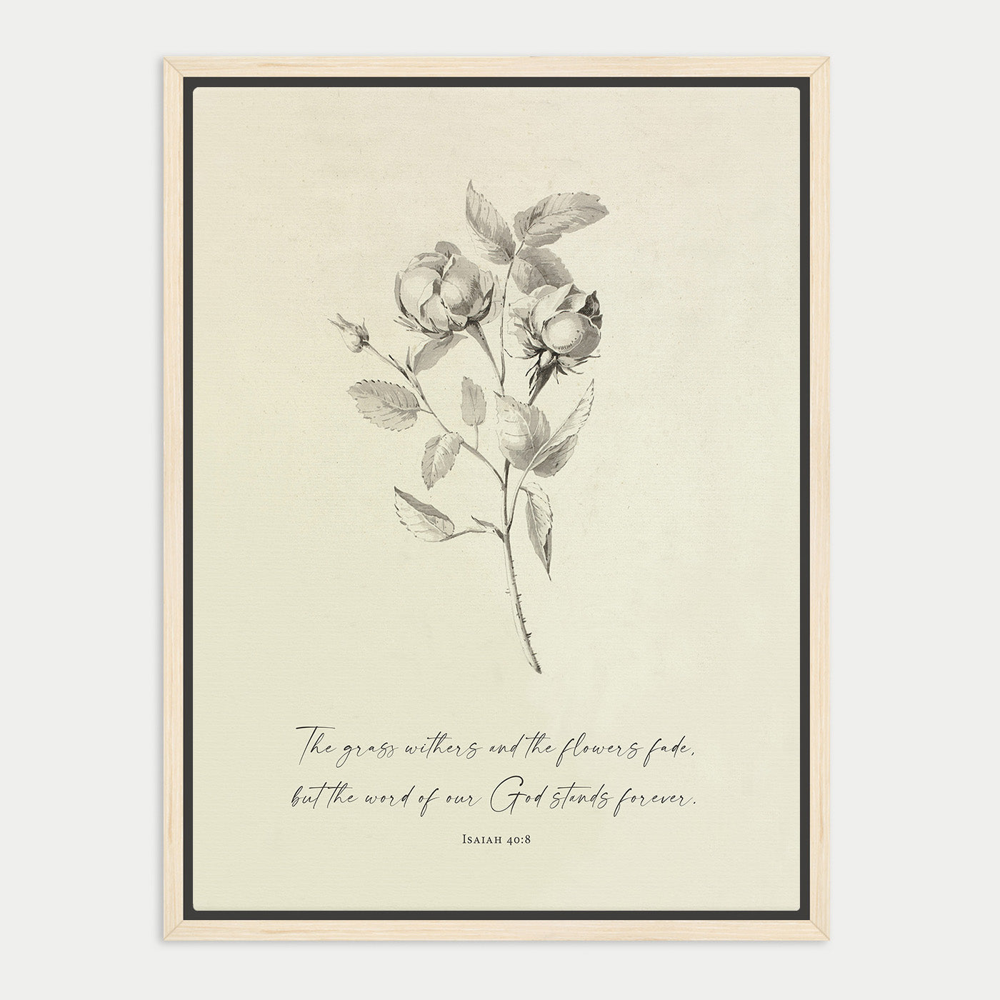 The image is a framed print featuring a black and white illustration of a rose with leaves, accompanied by a Bible verse from Isaiah 40:8.