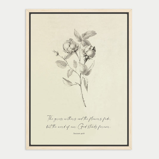 The image is a framed print featuring a black and white illustration of a rose with leaves, accompanied by a Bible verse from Isaiah 40:8.