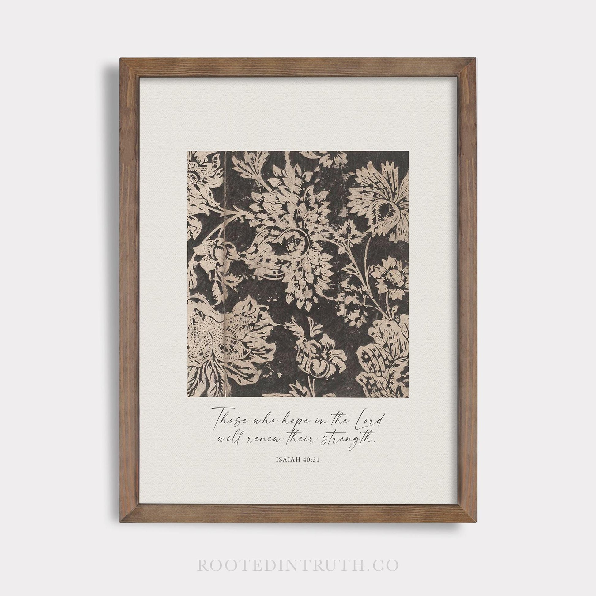 a black and white floral print with a wooden frame