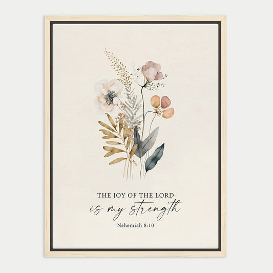 The image is a framed print featuring a floral illustration with the text "The joy of the Lord is my strength" and the Bible verse "Nehemiah 8:10" below it.