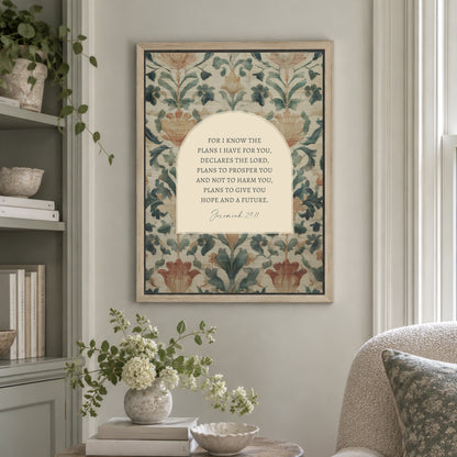 a framed print of a floral pattern hanging on a wall, with a quote from the Bible verse "Bible verse 29:11" below it. The print is surrounded by various decorative elements, such as a vase of flowers, books, and a potted plant.