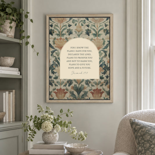 a framed print of a floral pattern hanging on a wall, with a quote from the Bible verse "Bible verse 29:11" below it. The print is surrounded by various decorative elements, such as a vase of flowers, books, and a potted plant.