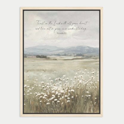 The image is a framed print depicting a serene landscape with a field of white flowers in the foreground and a mountainous background. The text overlay reads "Trust in the Lord with all your heart and lean not on your own understanding. Proverbs 3:5".