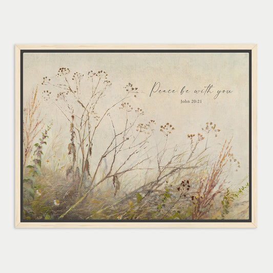 The image is a framed painting depicting a serene landscape with tall grasses and wildflowers. The text "Peace be with you" is written in cursive above the painting, and the date "John 20:1" is also visible.