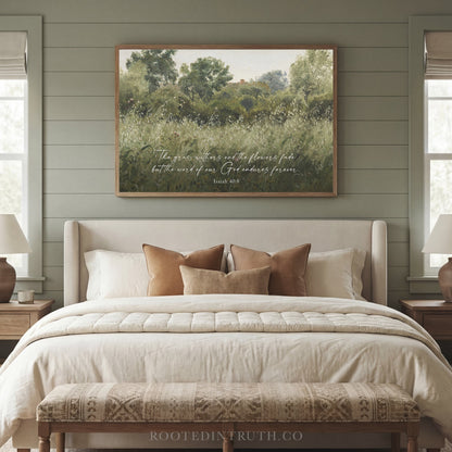 a serene bedroom scene with a large bed, a wooden bench, and a framed landscape painting hanging above it. The painting features a lush green field with trees and a clear sky. The bed is adorned with white linens and brown throw pillows, creating a cozy and inviting atmosphere. The wooden bench and nightstands provide additional storage and functionality to the space.