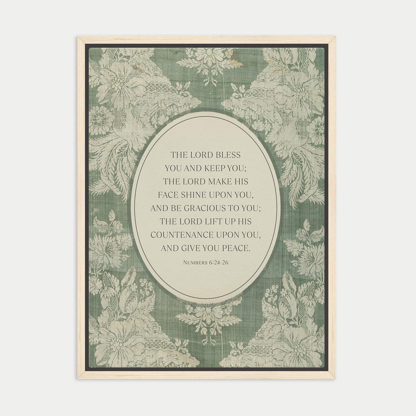 The image is a framed print featuring a floral pattern and a central text quote from the Bible, specifically the Book of Common Prayer.
