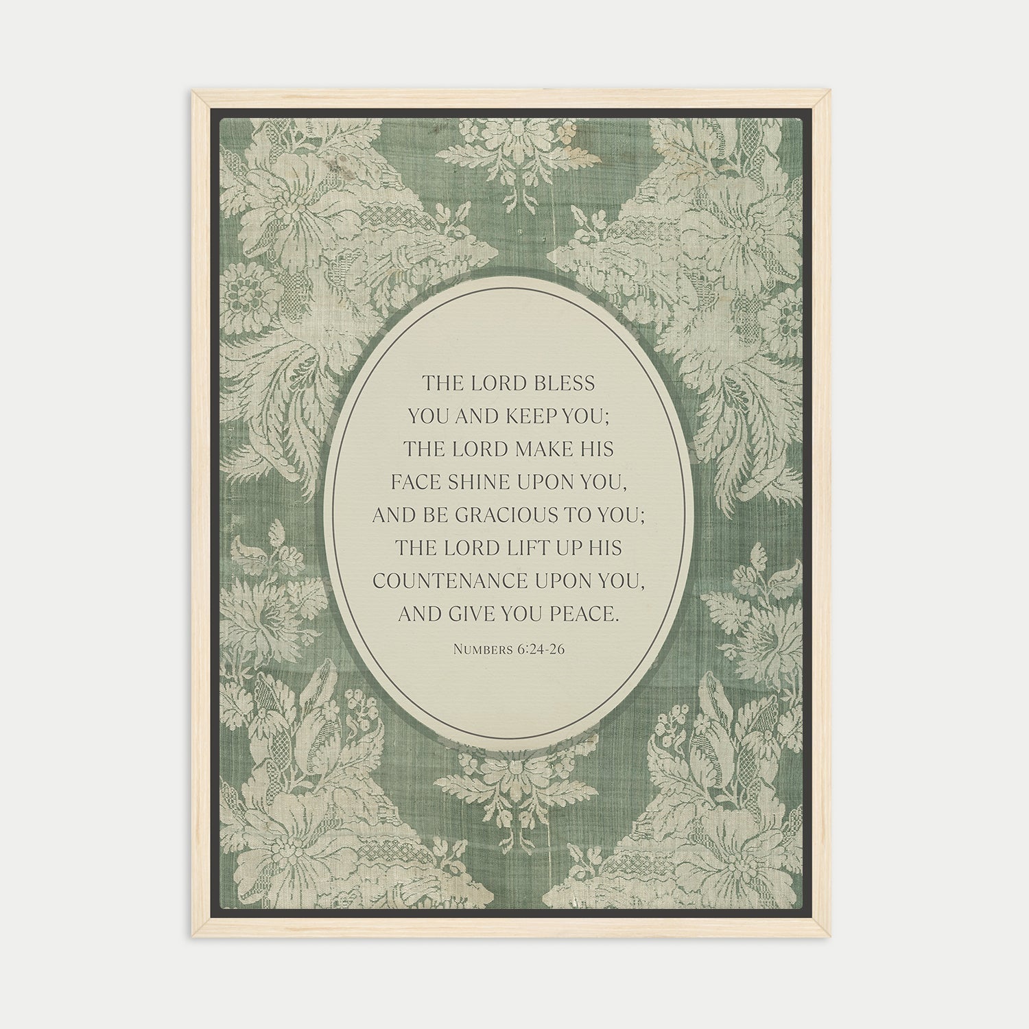The image is a framed print featuring a floral pattern and a central text quote from the Bible, specifically the Book of Common Prayer.