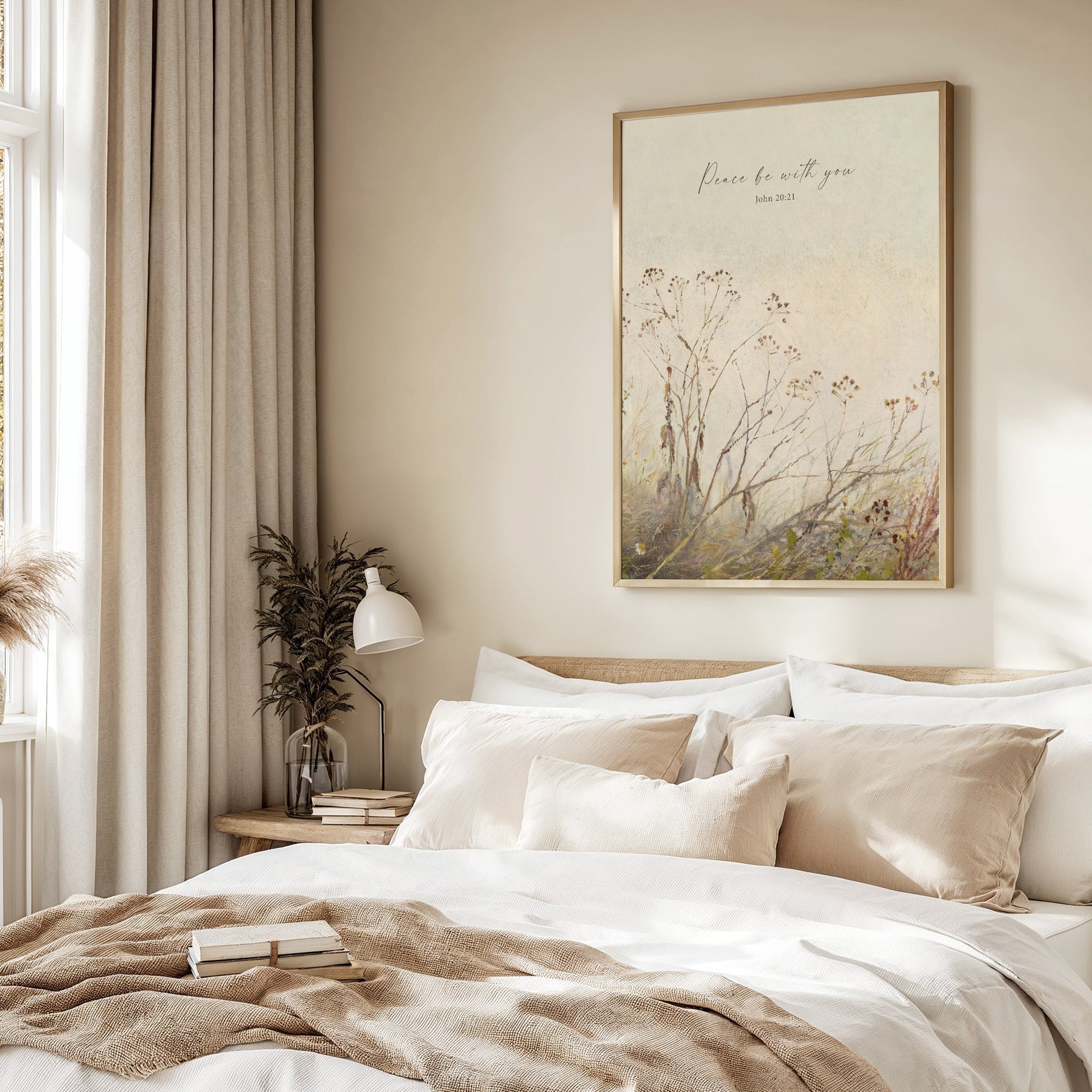 a serene and cozy bedroom scene, featuring a large bed with white linens and beige throw pillows, a nightstand with a lamp and a plant, and a framed artwork hanging on the wall above the bed.