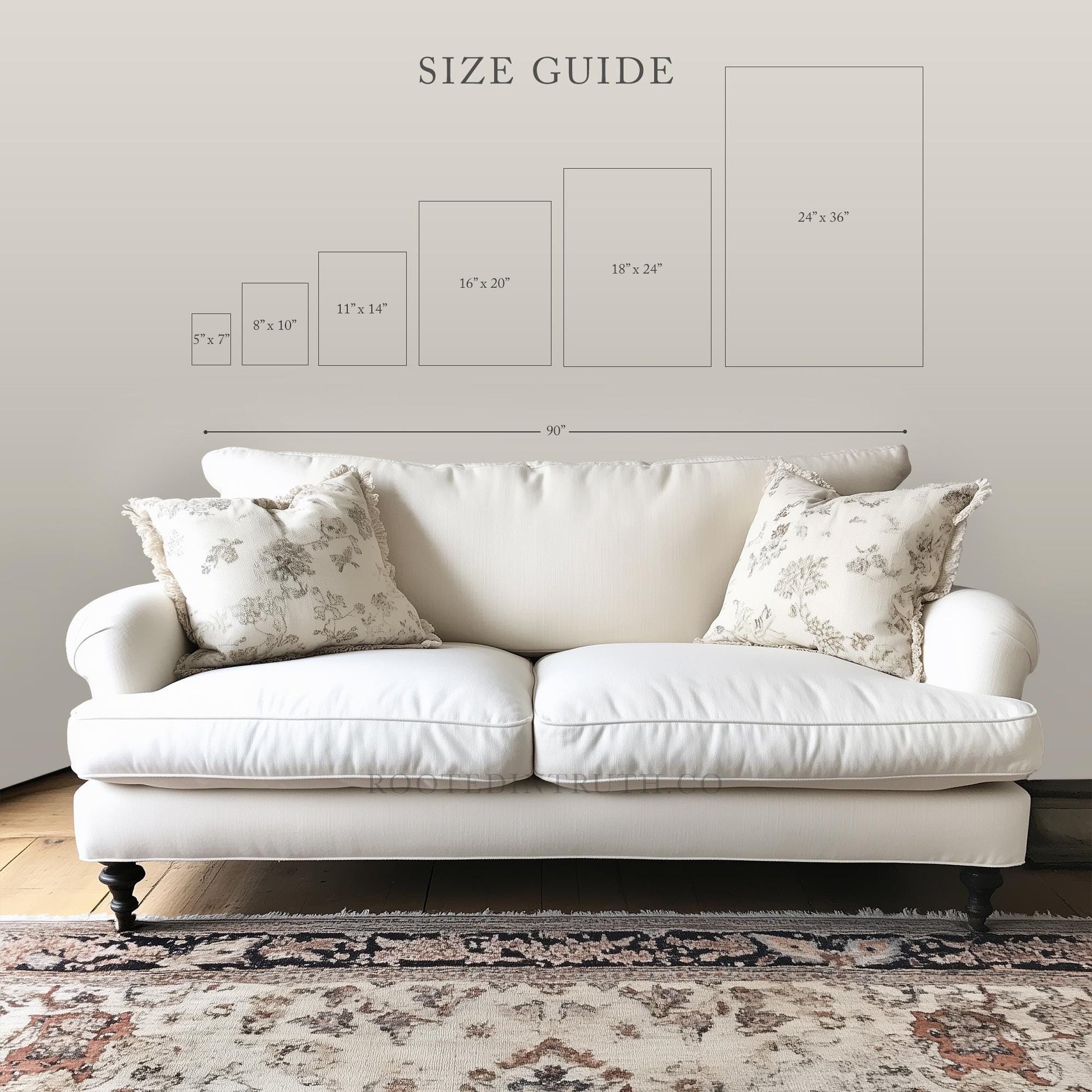 a white couch sitting on top of a wooden floor