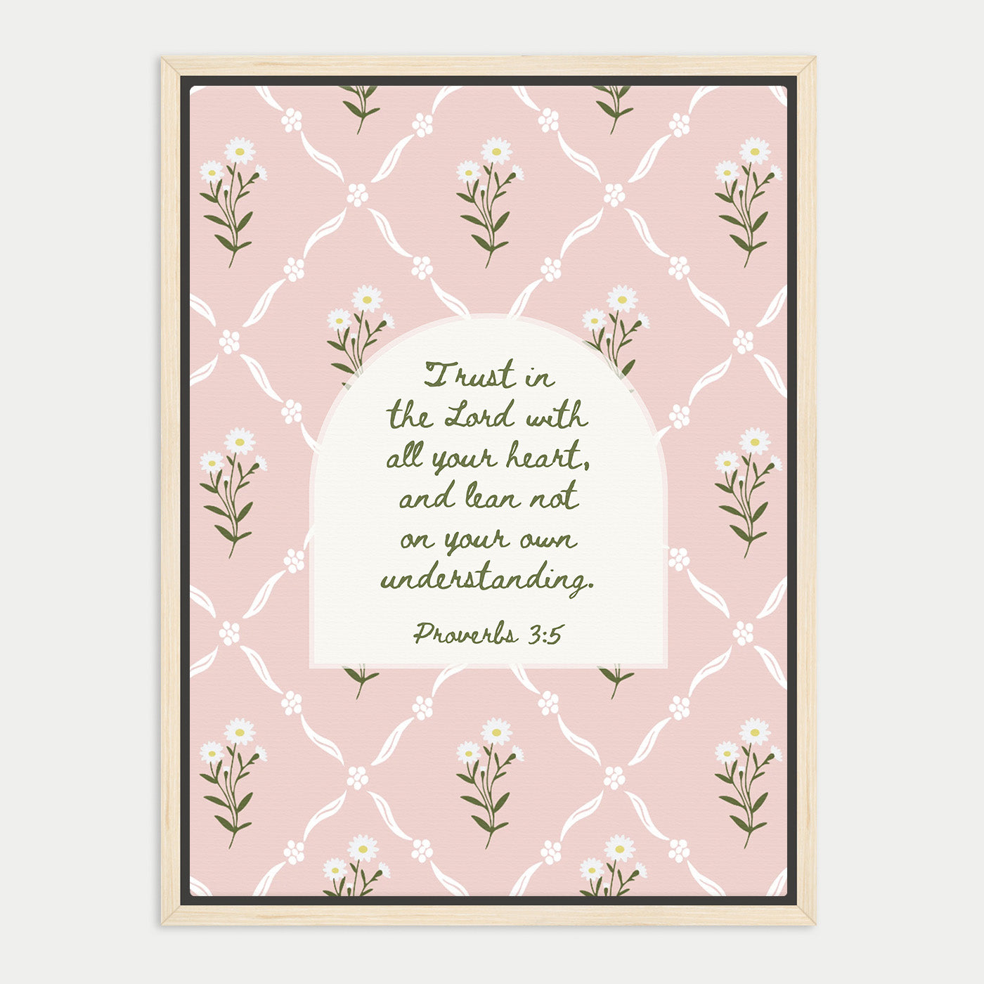 The image is a framed print featuring a repeating pattern of white flowers on a pink background. The central focus is a quote from the Bible, specifically Proverbs 3:5, which reads "Trust in the Lord with all your heart, and lean not on your own understanding."