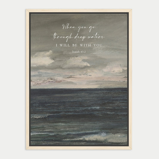The image is a framed print featuring a seascape with a text overlay that reads "When you go through deep waters, I will be with you. Isaiah 45:2".
