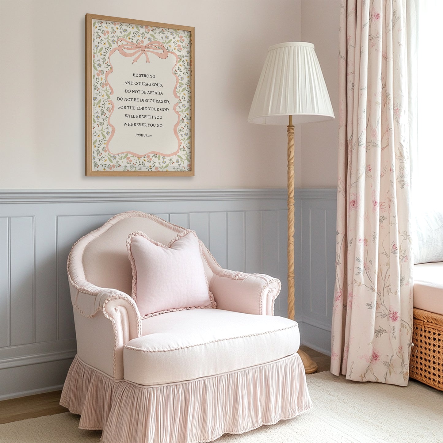 a cozy corner of a room with a pink armchair, a floor lamp, and a framed inspirational quote on the wall.