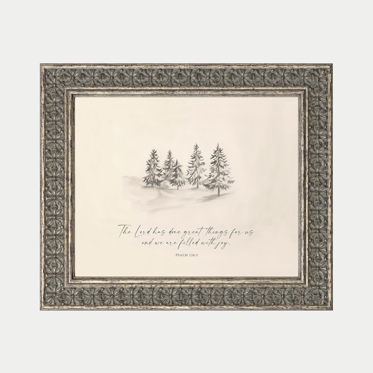 a framed illustration of a snowy landscape with a group of pine trees in the background.