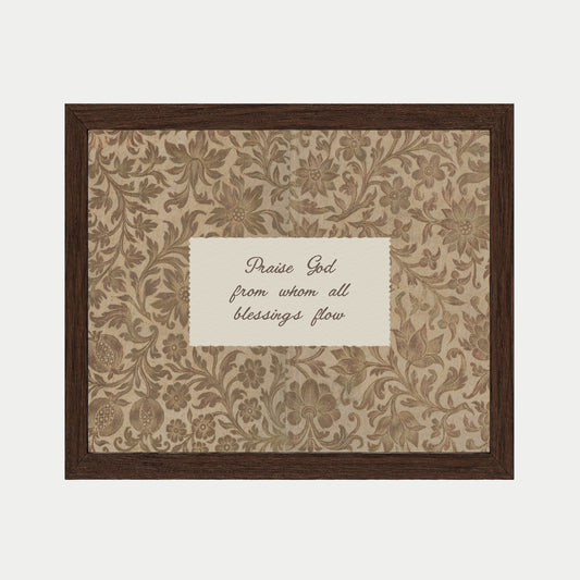a framed piece of art with a floral pattern and a message written in cursive on the back.