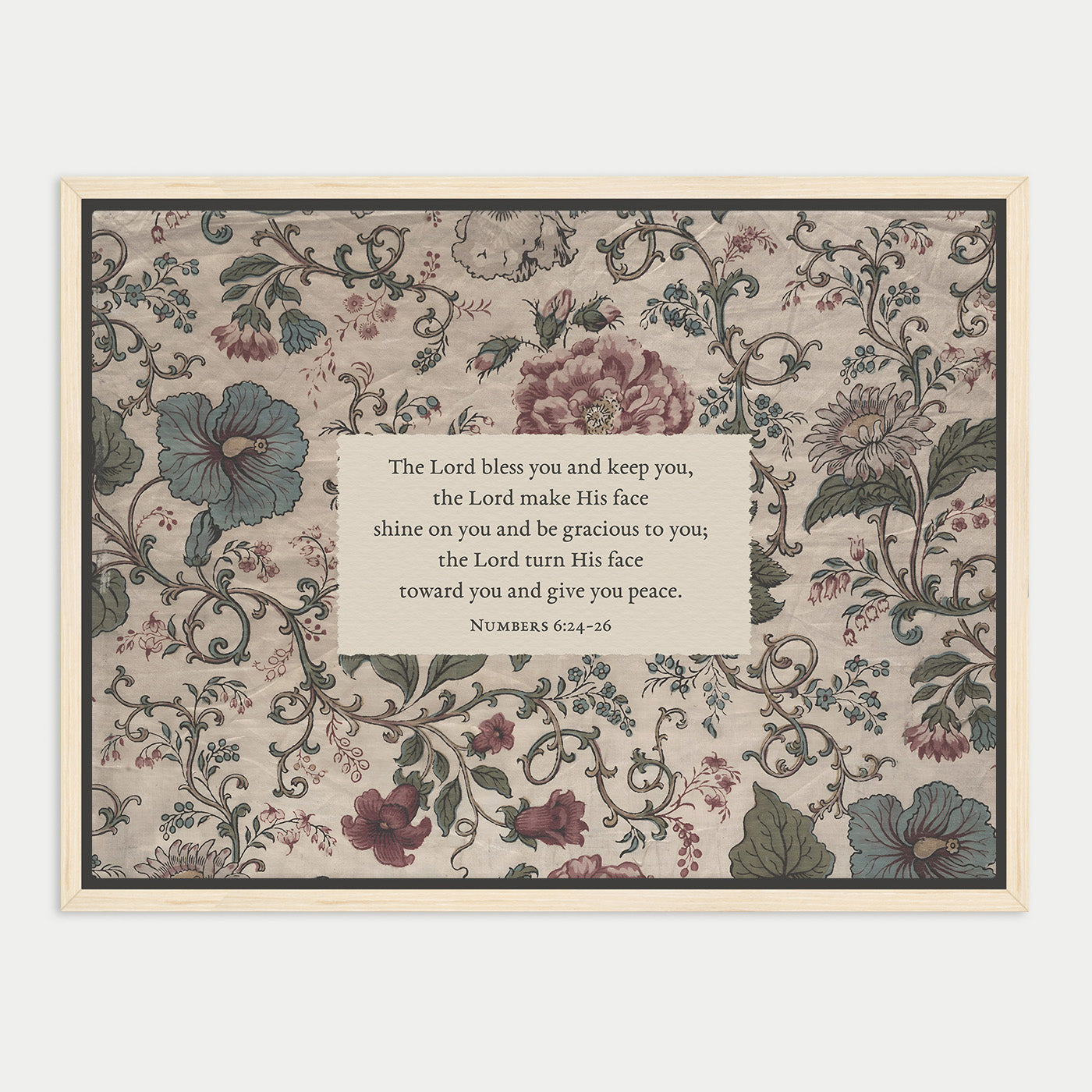 The image is a framed print featuring a floral pattern with a central text box containing a religious message.