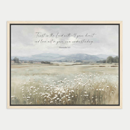 The image is a framed print depicting a serene landscape with a field of tall grass and mountains in the background. The text overlay reads "Trust in the Lord with all your heart and lean not on your own understanding."