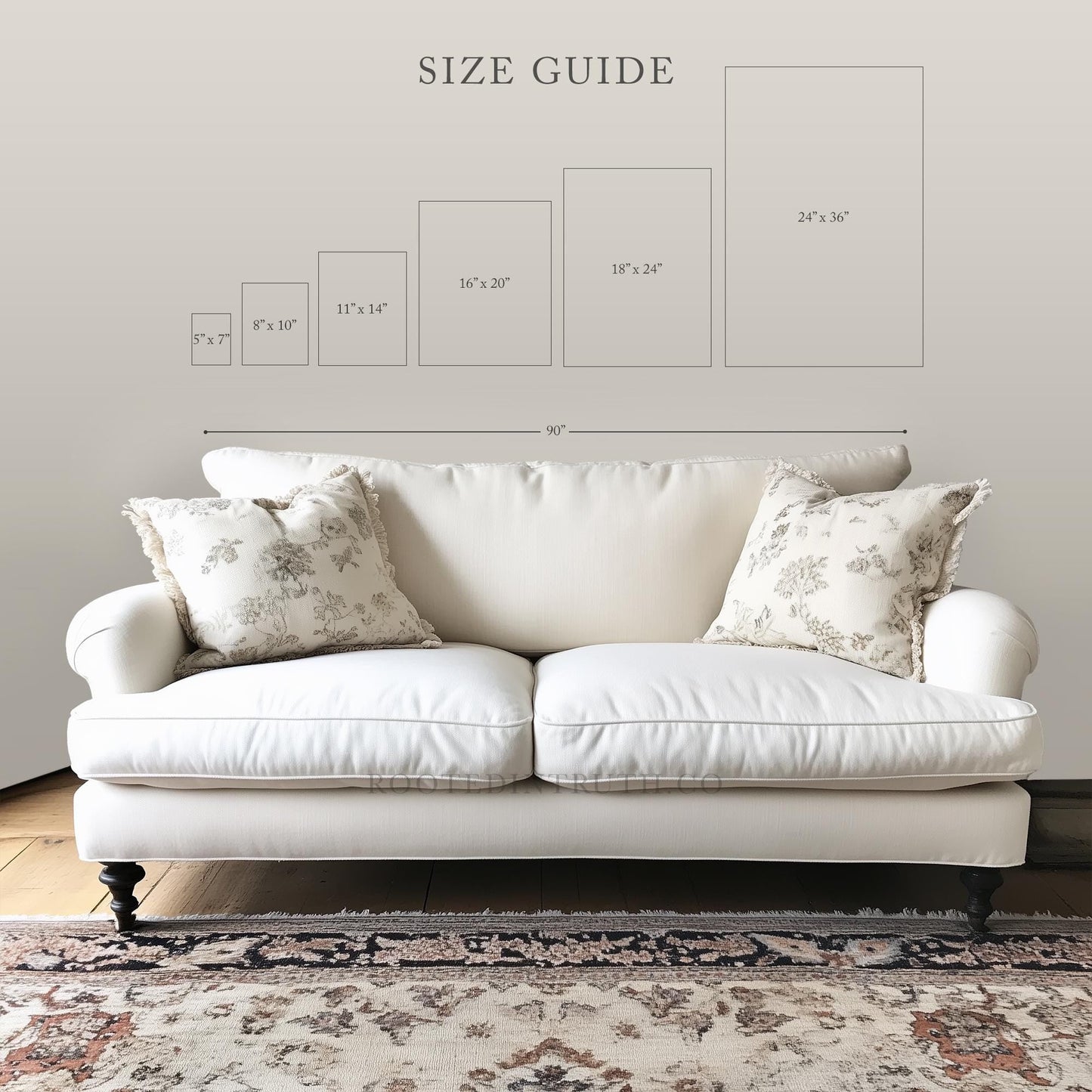 a white couch sitting on top of a wooden floor