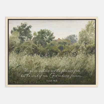 The image is a framed painting depicting a lush, verdant landscape with trees and grass, accompanied by a Bible verse from Isaiah 40:8.