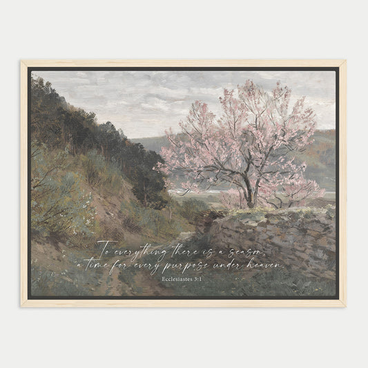 a serene landscape with a tree in full bloom, surrounded by lush greenery and a body of water. The text overlay provides a biblical reference, "To everything there is a season, a time for every purpose under heaven. Ecclesiastes 3:1".